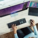 person using laptop on table